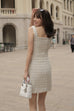 Modern but cute tweed dress in beige